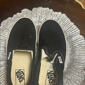Vans Black Canvas Slip-Ons